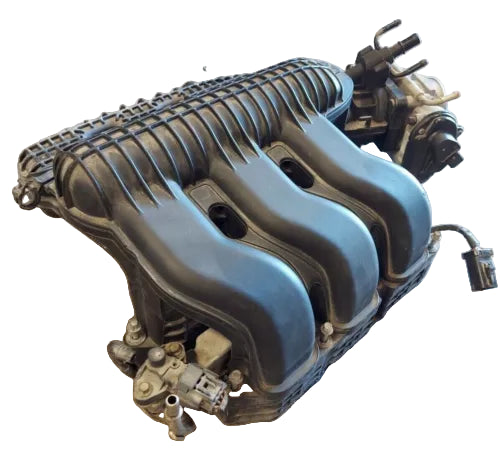 Engine valve cover on a concrete floor